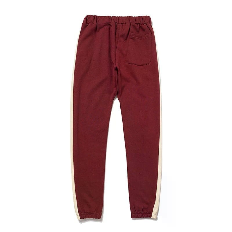 Red jogger pants with side stripe details, cozy and stylish for casual wear.