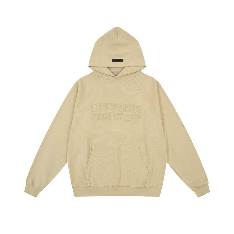 The Cruiser Hoodie by Fear of God ESSENTIALS in beige color, featuring embossed text on the front and a relaxed fit, perfect for fans of K-pop merchandise.