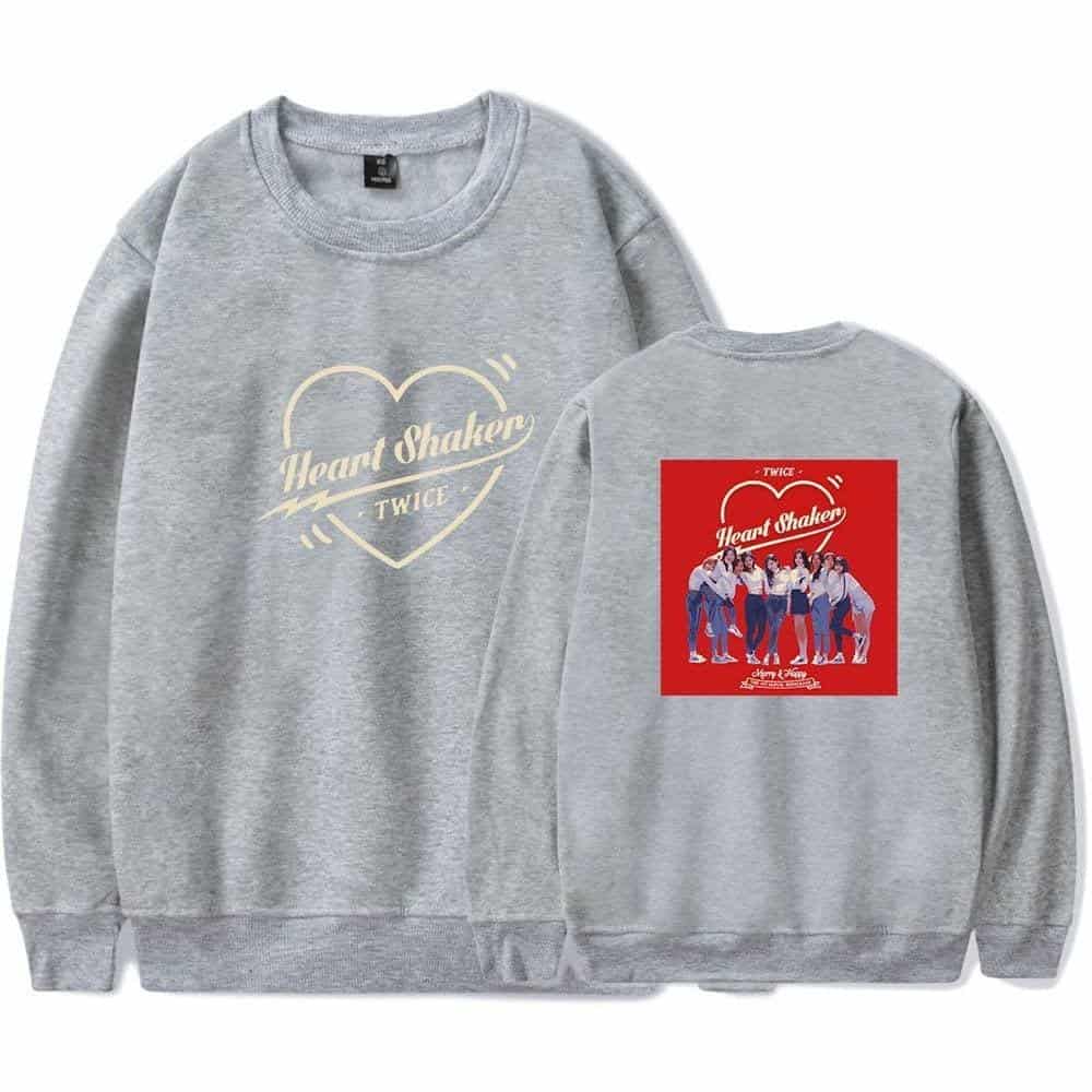 Heart Shaker TWICE sweatshirt, grey crewneck with group image and logo, popular K-pop merchandise, casual fan apparel, TWICE fan gift, stylish K-pop group hoodie, vibrant group photo print, pop music apparel, K-pop concert merch, trendy fan clothing.