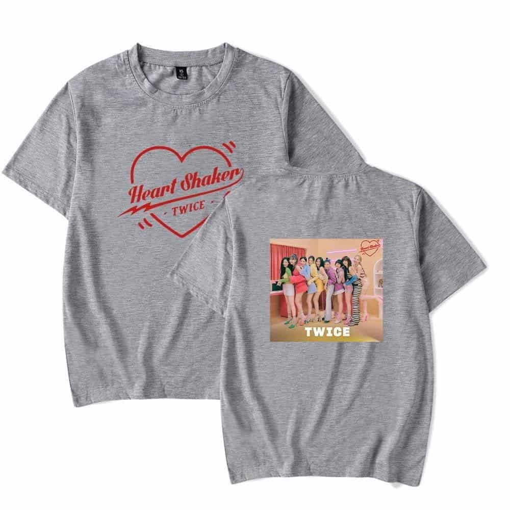 Heart shaker twice kpop merch t-shirt featuring TWICE group image and Heart Shaker graphic on grey fabric.