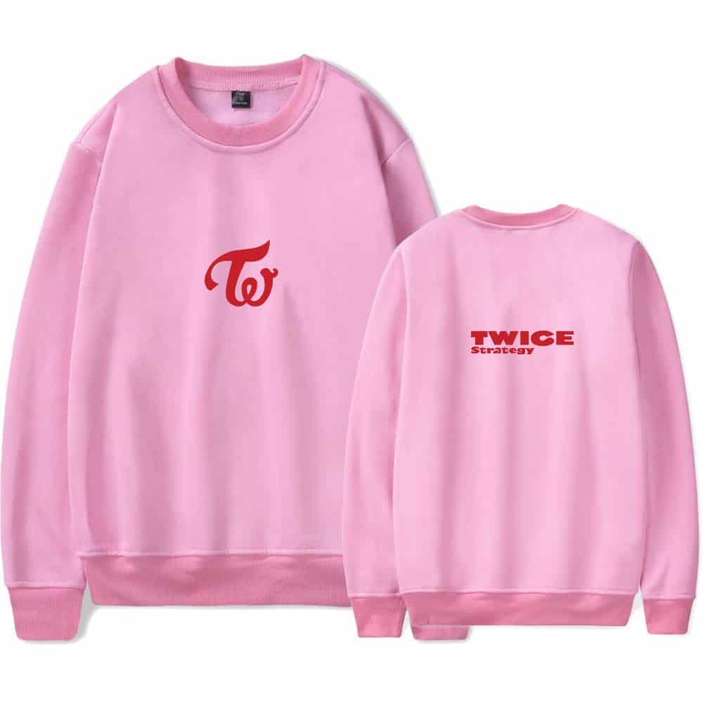 TWICE K-pop merch pink sweatshirt with TWICE logo and strategy text, perfect for fans of the girl group. Stylish and comfy, ideal for showing support during concerts or casual outings.