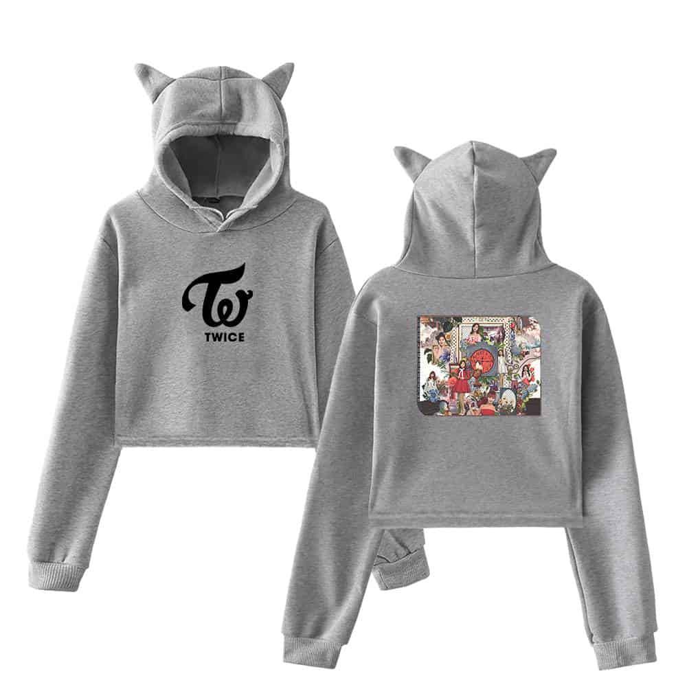 Twice kpop merch hoodie and sweatpants set with adorable cat ears on the hood, featuring TWICE logo and colorful group artwork on the back, perfect for fans of the popular K-pop girl group.