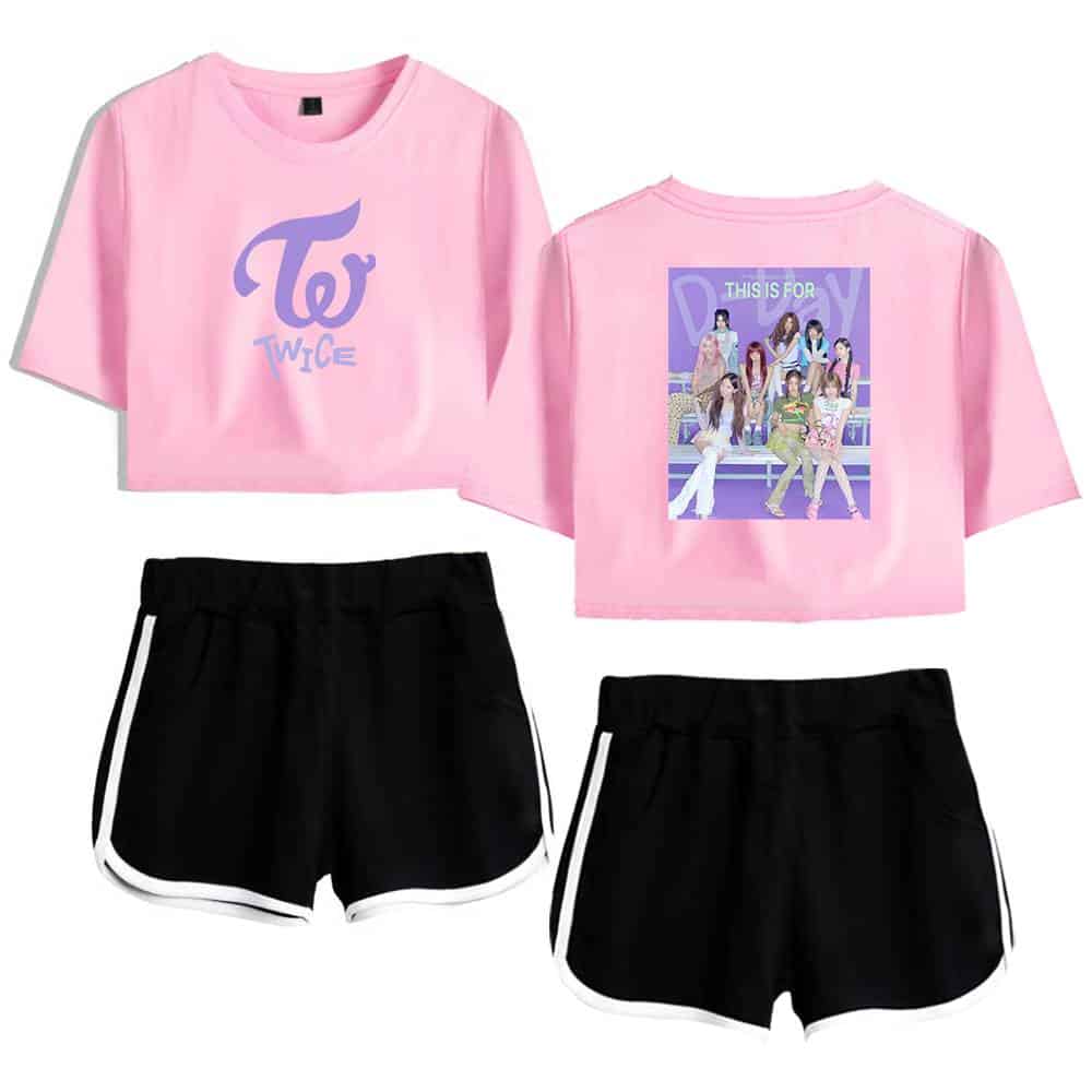TWICE K-pop merchandise, pink crop top with TWICE logo and photo print, paired with black athletic shorts with white trim. Perfect for TWICE fans and K-pop enthusiasts. High-quality design for everyday wear.